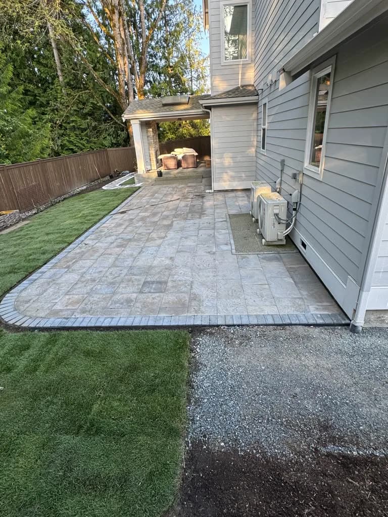 Completed paver patio with lawn